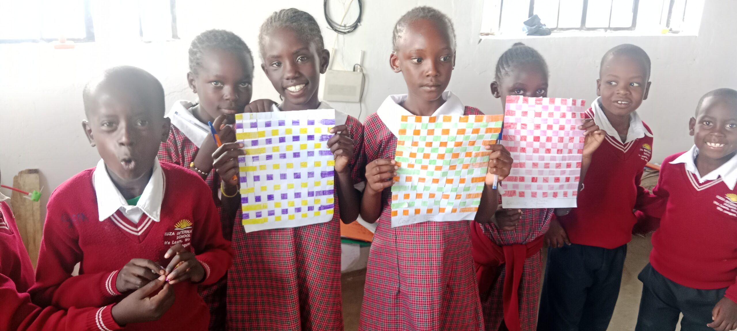 Kuza learners showing their creative learning work