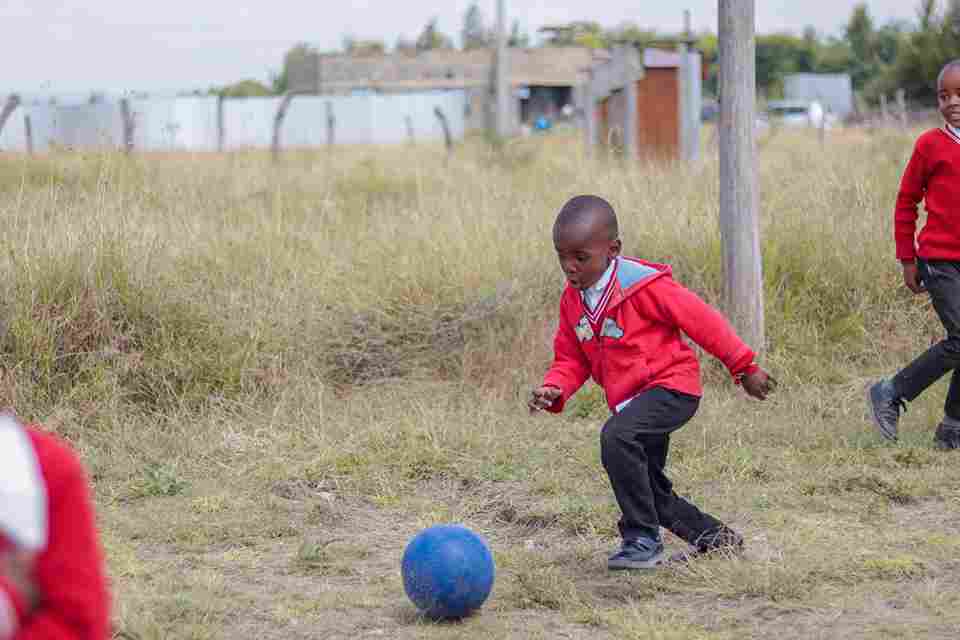 A Kuza pupil playing football